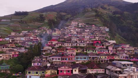 Wide-shot-of-Nepal-van-java-on-the-slopes-of-mount-sumbing-Indonesia,-aerial