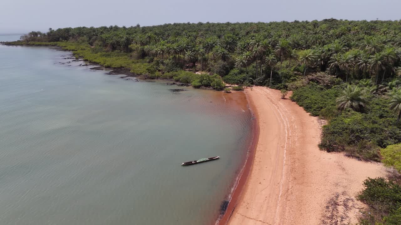 Breathtaking drone shot over Pink Sand Beach, Bijagós Islands, Guinea-Bissau, with unspoiled shoreline, tropical wilderness and scenic coastline views