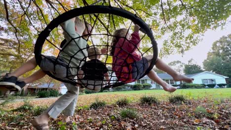 family fun: kids swinging in the backyard