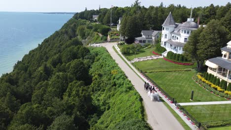 following horse drawn carriage over cliff