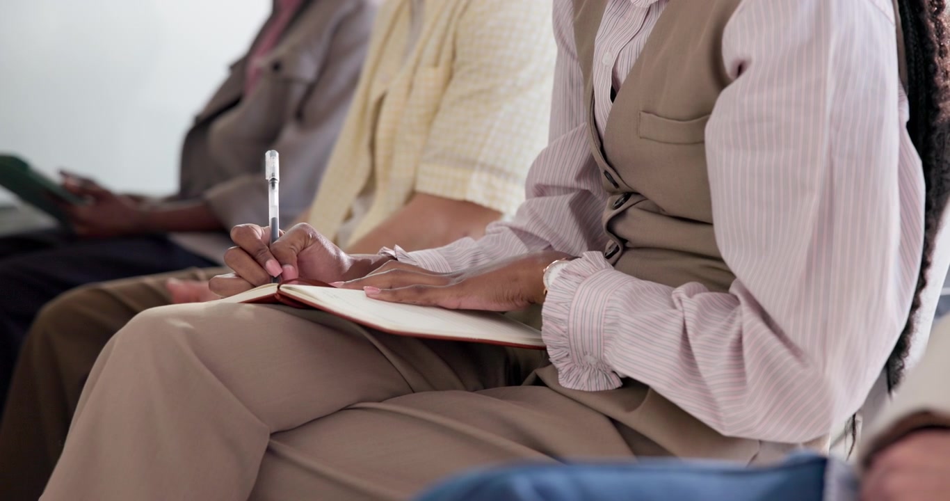 Professional Woman Taking Notes in a Business Meeting