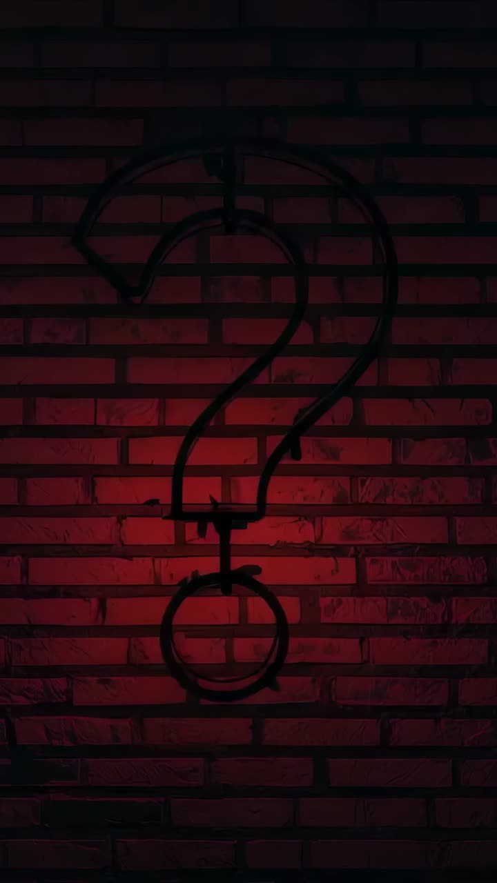 Vertical video: Flashing question-mark neon sign pulsing from power on brick wall showing wires