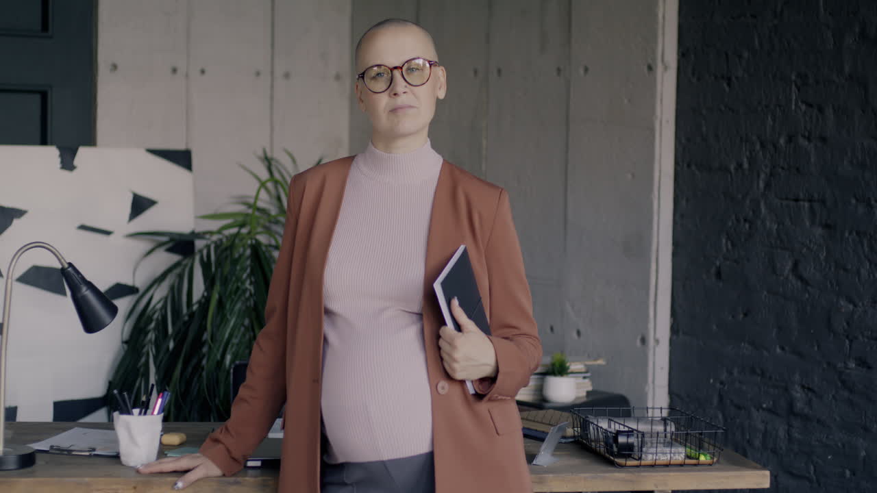 Confident Pregnant Business Woman in Modern Office