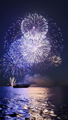 spectacular night fireworks display over water