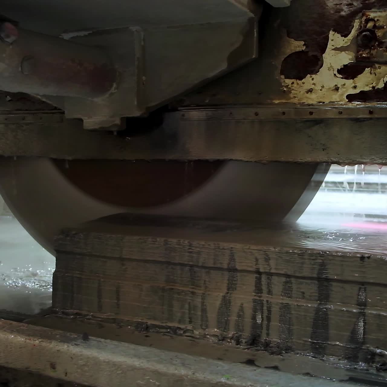 Huge round electric saw cutting the ferroconcrete plate easily. Equipment at modern construction plant. Close up