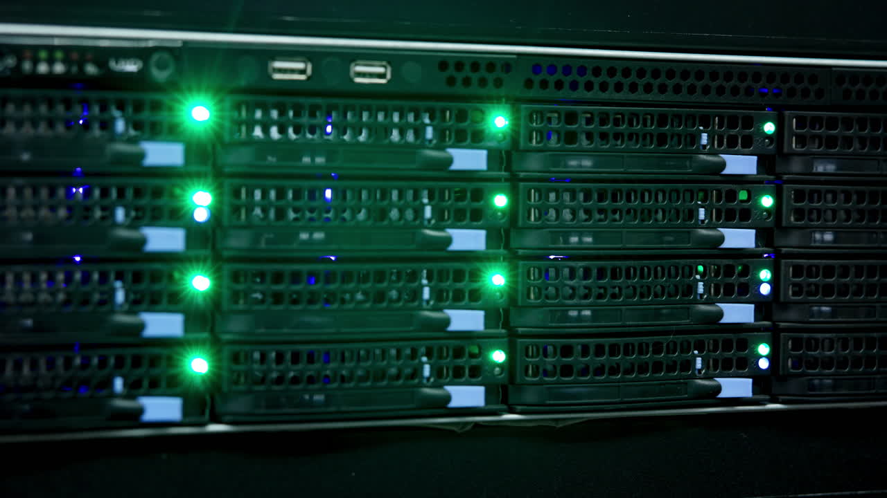 Close-up of server racks with blinking green and blue lights in a data center