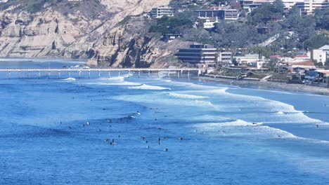narrow aerial view of scripps pier in la jolla