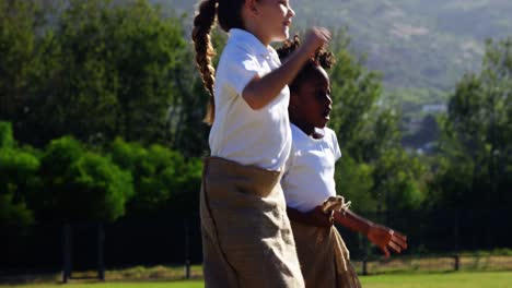 children playing a sack race in park