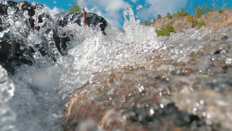 crystal clear cascades over rocky valley on sunny summertime