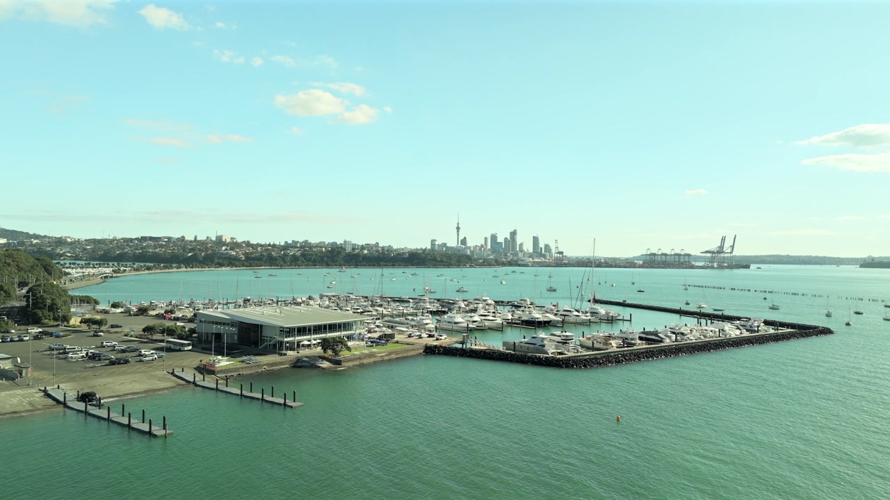Marina Tilt Shot with Sky Tower in Distance