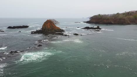 Drone-shot-of-the-rock-island-in-the-sea-in-Panama