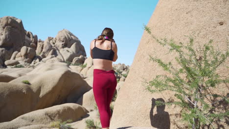 female photographer at joshua tree, california, taking landscape photos, slow motion tracking