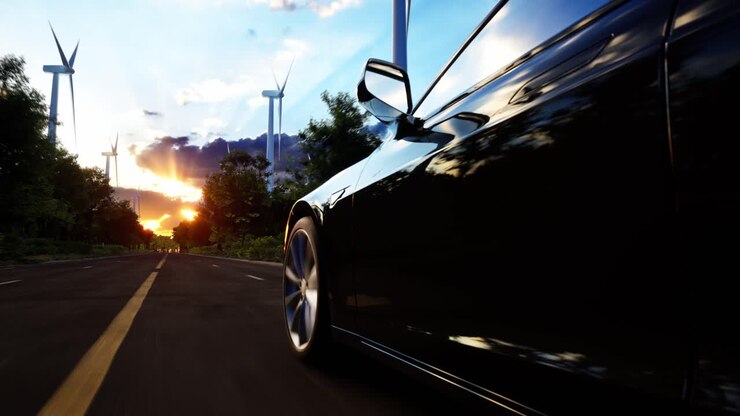 3D Render Of Generic Electric Car Drives On A Road With Wind Turbines In The Background. Realistic 3D Animation