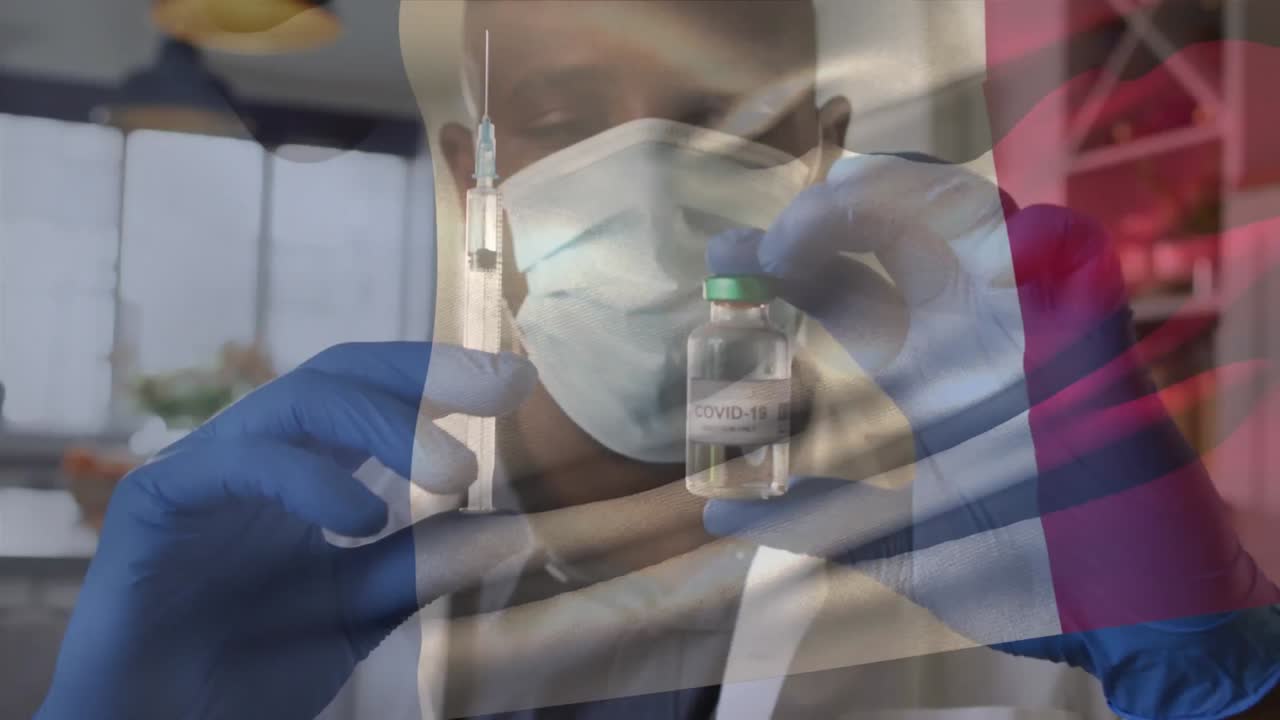 Animation of flag of france waving over doctor wearing face mask and holding vaccine