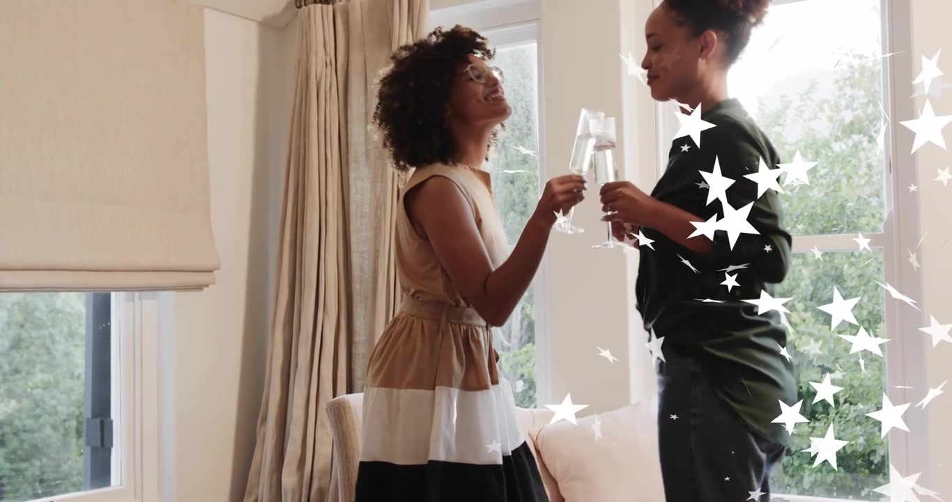 Two women entering room clinking champagne flutes as star overlays floating celebrating marketing