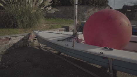 close view of sailboat and red buoy on it parked in hunstanton england