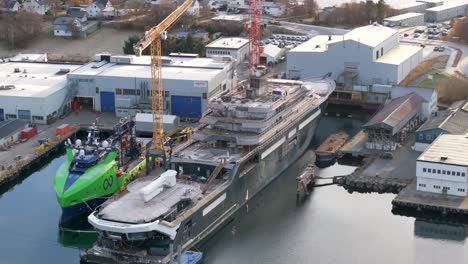 Drone-film-of-REV-Ocean,-a-privately-funded-research-and-expedition-vessel-under-construction-at-VARD-shipyards-in-Søvik,-Norway