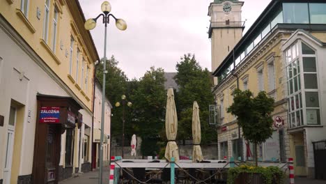 Town-city-center-shot-revealing-church-in-alleyway