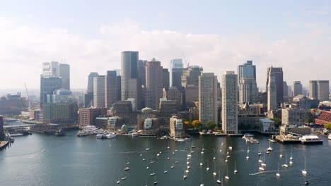 aerial shot of boston harbor with city skyline