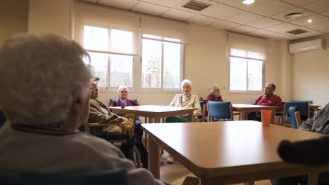 old people gathering in lounge of retirement home