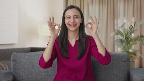 happy indian woman showing okay sign