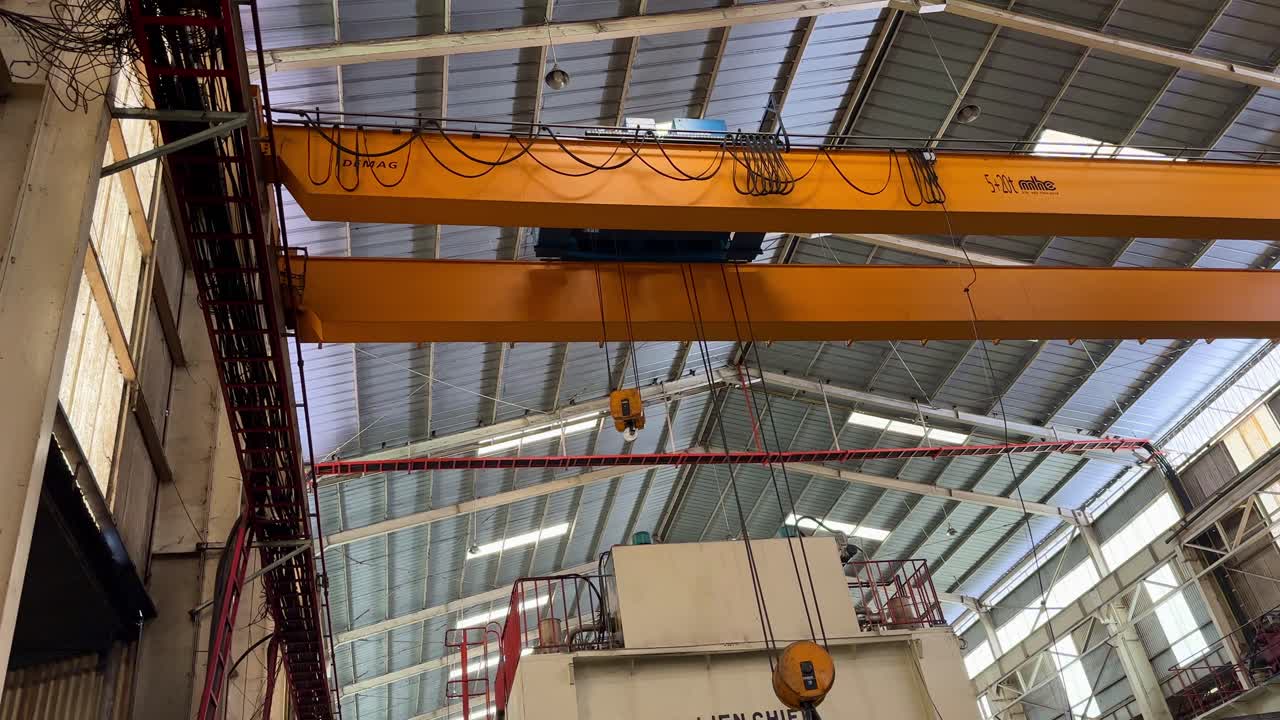 Orange overhead crane on the factory. Industrial concept.