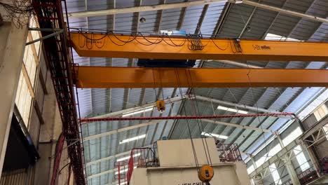 orange overhead crane on the factory. industrial concept.