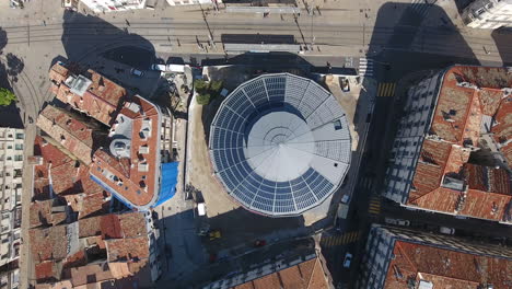 renewable solar green energy on a circular building roof. montpellier aerial