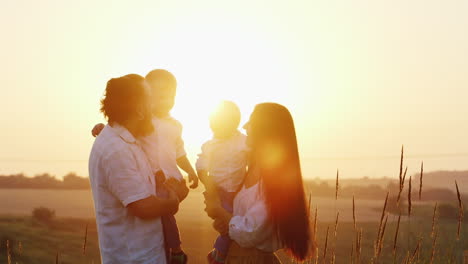 the bearded daddy together with his mother and their young sons communicate with each other against