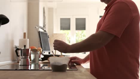 man making coffee at home in the morning