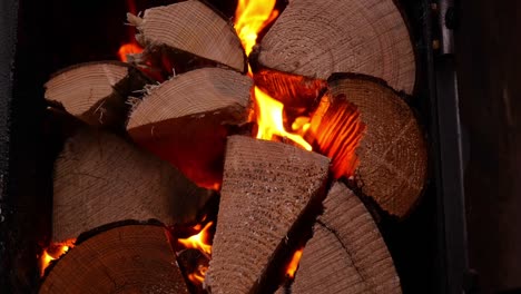 close up of wood logs burning for hot tub