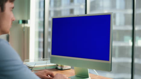 unrecognized director working chroma key device. businessman using computer