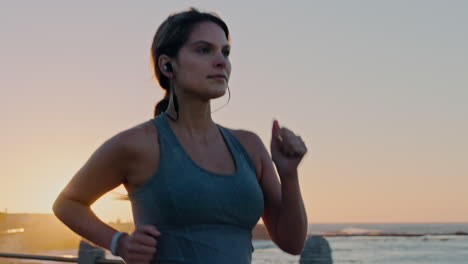 Beach,-earphones-and-woman-running-at-sunset