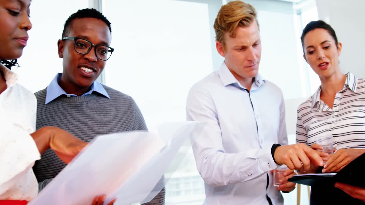 Executives discussing over a document