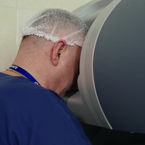 professional surgeon manages the robotic machine. doctor works with a da vinci robotic equipment. remote treatment of cancer patients and infected. innovations in medicine