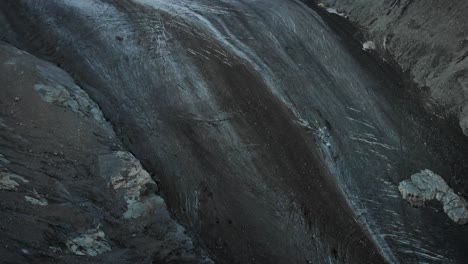 sunrise at corbassiere glacier in valais, switzerland with aerial pan up