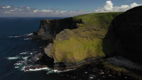 Fallen-cliffs-of-Cliffs-of-Moher-Irish-coastline,-coastal-erosion,-aerial-dolly