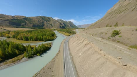 aerial view automobile traffic on highway speed asphalt road natural mountain sunny valley