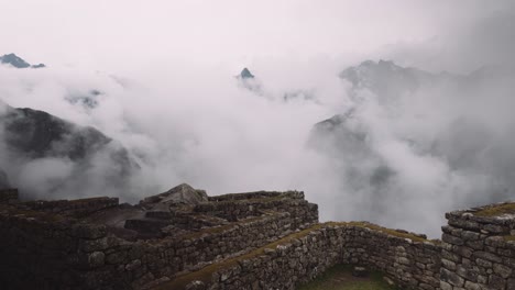 historical ruins of machu picchu with the misty mountain background in cusco, peru. aerial shot
