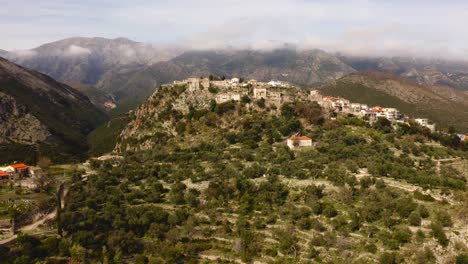 ancient-Himara-castle-and-the-village-old-town-up-the-hills-of-Ceraunian-Mountains-in-Vlore-County,-Albania
