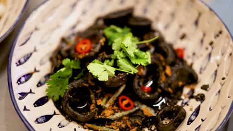 black ink squid pasta with coriander and chili