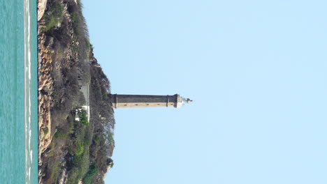 vertical gimbal shot of ke ga lighthouse on sunny day, vietnam