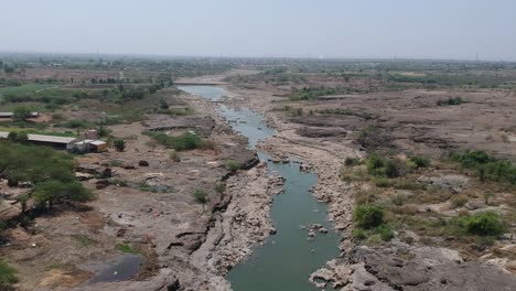 aerial drone footage of a river with potholes - at nighoj near pune and is famous for the naturally created potholes on the riverbed of the kukadi river