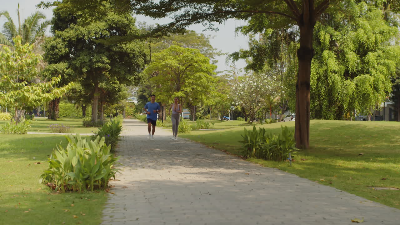 Couple Jogging Together on Sunday Morning Outdoors