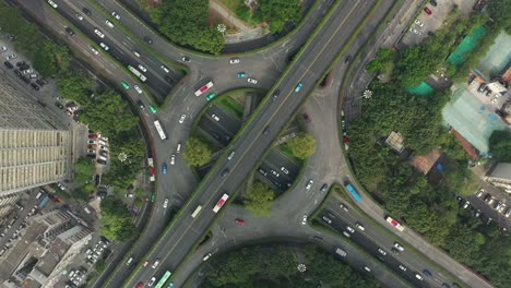 day time guangzhou city traffic street road circle interchange aerial topdown panorama 4k china