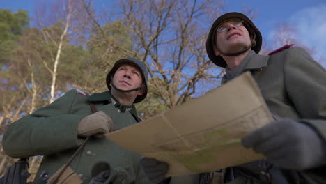 german soldiers studying a map