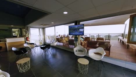 airport lounge waiting area with view of airplane and runway