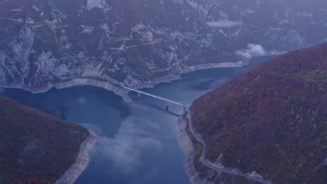 reveal shot of canyon of piva river, pluzine town, montenegro, aerial