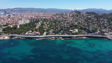 aerial traveling toward marseille south district coastal road sunny day.