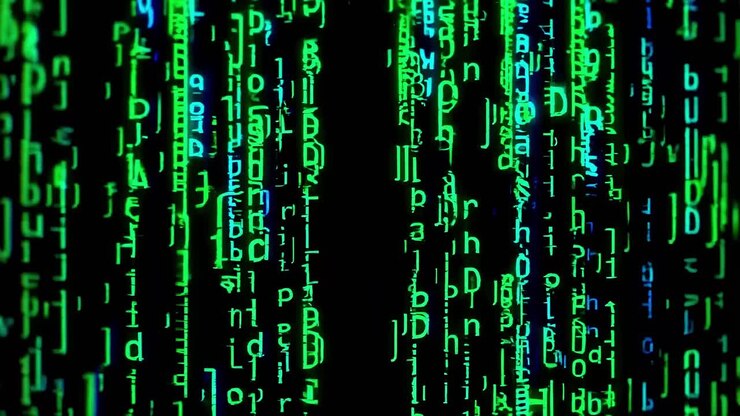 Abstract video of green and blue digital code cascading down a screen, captured from a front-facing